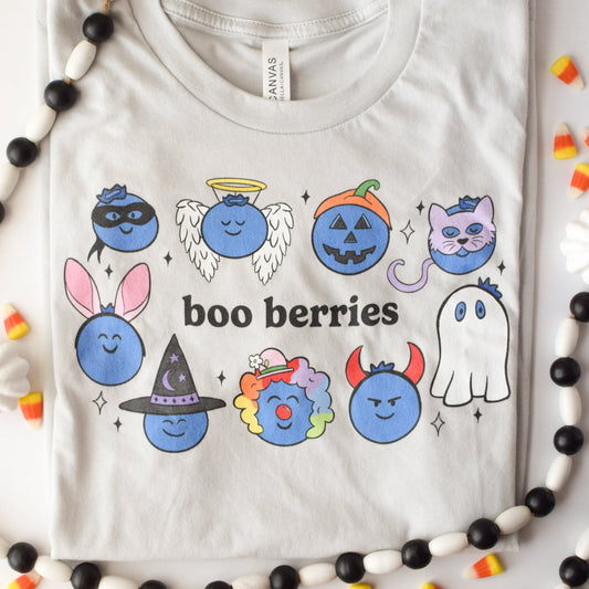 Very light gray tshirt with blueberries in Halloween costumes with the pun "boo berries"
