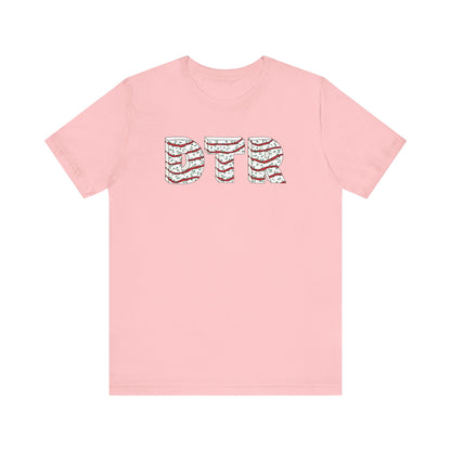Pink t-shirt with a graphic design on the back against a white background