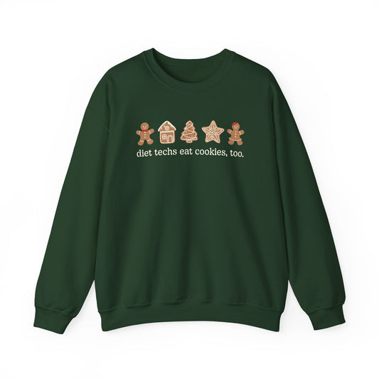 Green sweatshirt with gingerbread-themed design and text on a white background