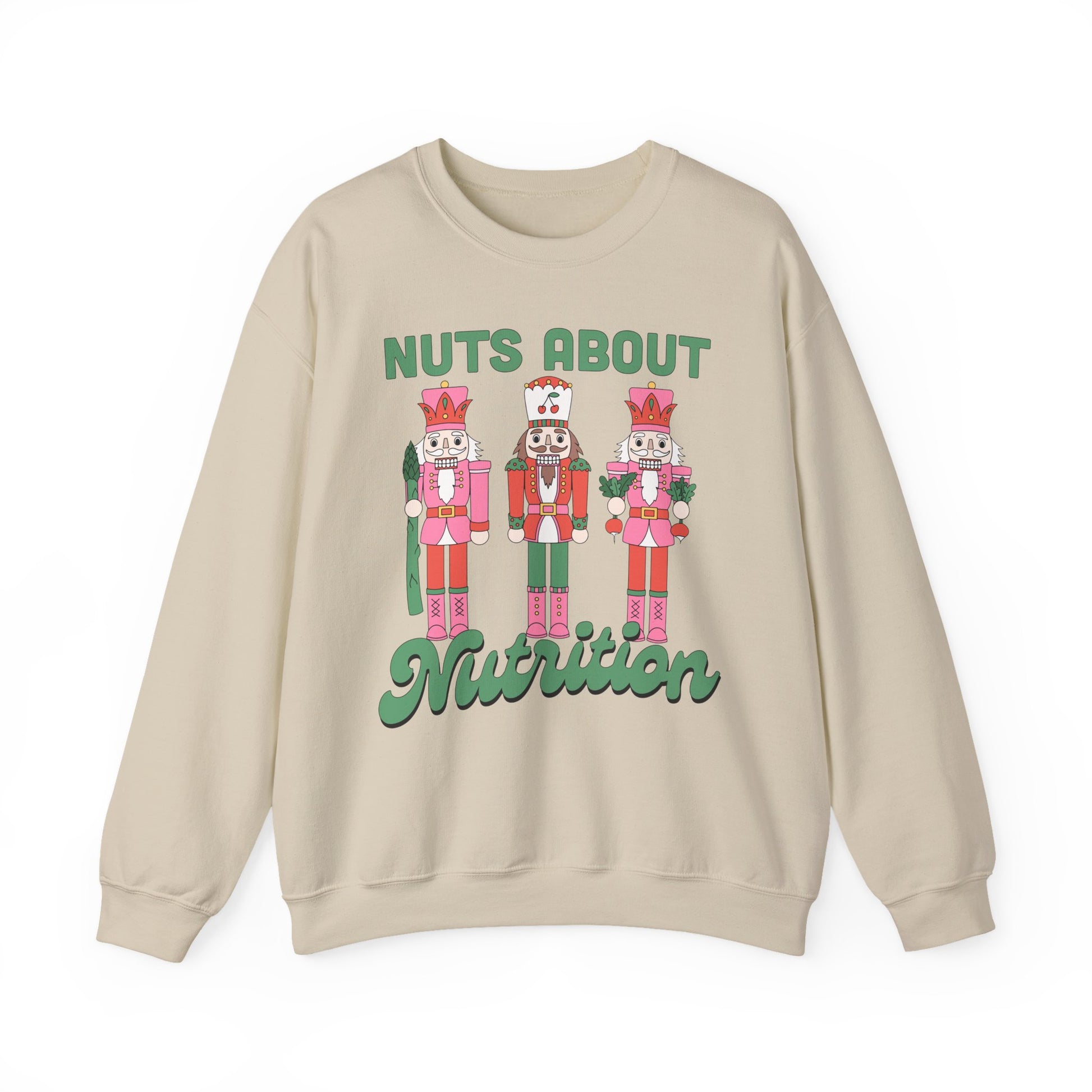 Sand colored sweatshirt with nutcracker design and text 'Nuts About Nutrition' on a white background