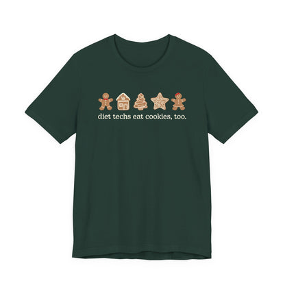 Green t-shirt with gingerbread-themed design and text on a white background