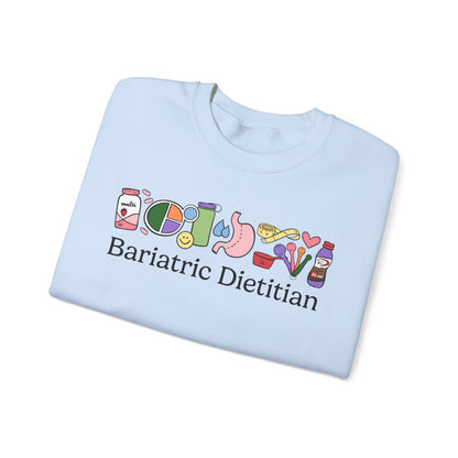 Light blue t-shirt with colorful graphics and text 'Bariatric Dietitian' on a white background