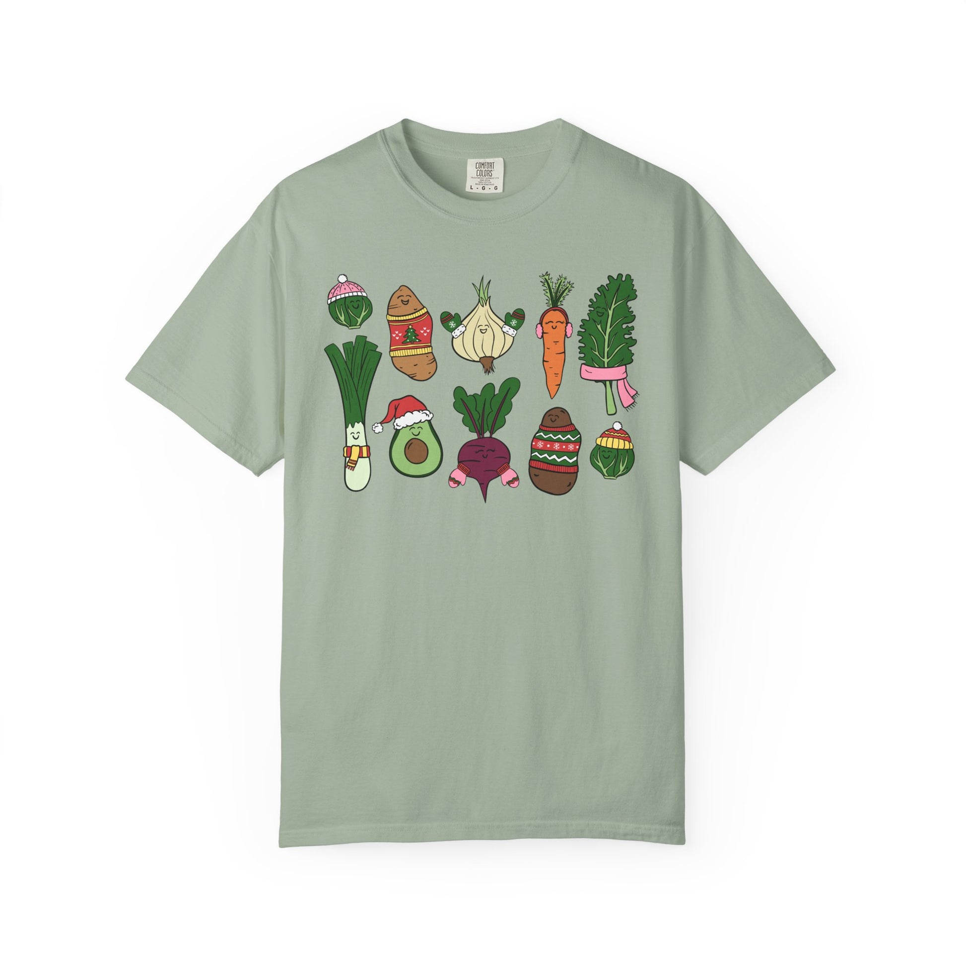 Green t-shirt with cartoon vegetable designs on a white background