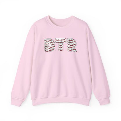 Pink sweatshirt with decorative letters on a white background