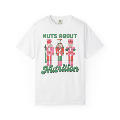 White t-shirt with nutcrackers and 'Nuts About Nutrition' text on a white background