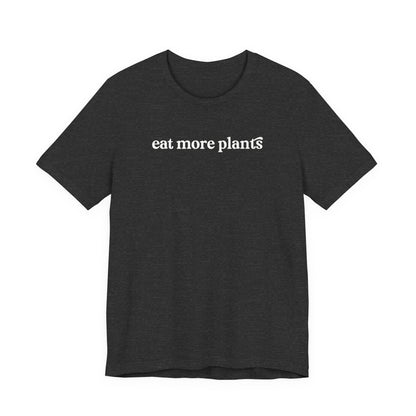 Black t-shirt with 'eat more plants' text on a white background