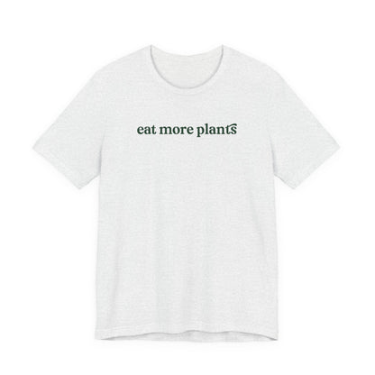 White t-shirt with 'eat more plants' text on a white background