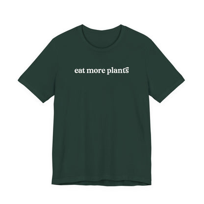 Green t-shirt with 'eat more plants' text on a white background