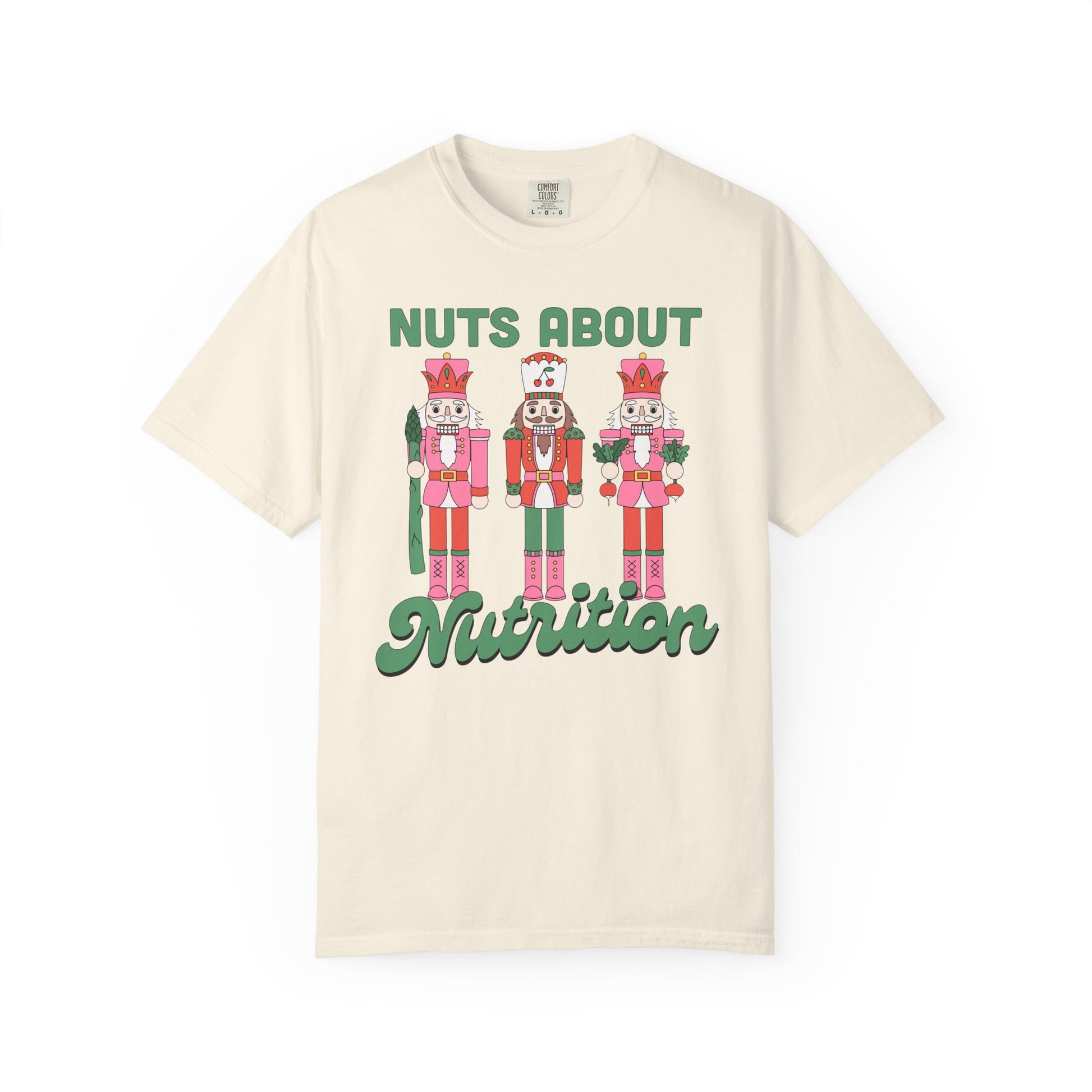 Ivory t-shirt with nutcracker design and 'Nuts About Nutrition' text on a white background