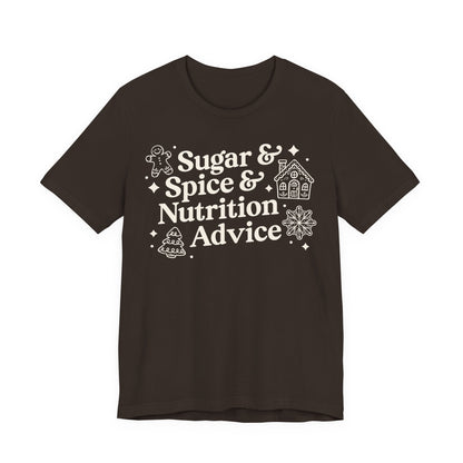 Brown t-shirt with white text 'Sugar & Spice & Nutrition Advice' and white gingerbread cookie graphics on a decorative background