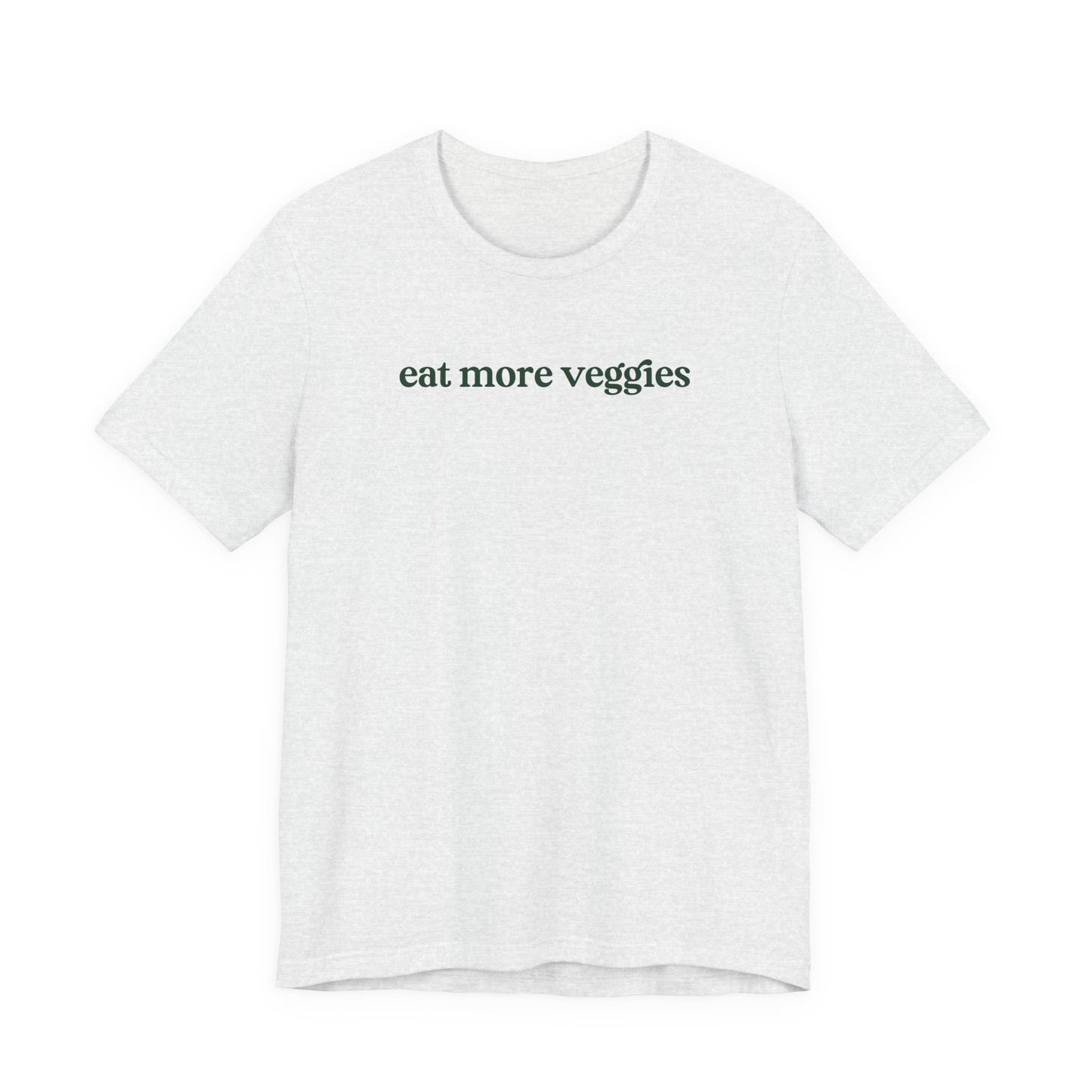 White t-shirt with 'eat more veggies' text on a white background