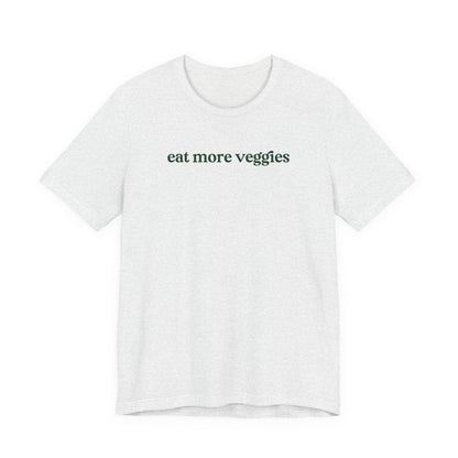 White t-shirt with 'eat more veggies' text on a white background