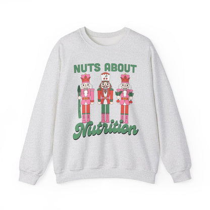 Ash Gray sweatshirt with nutcracker design and 'Nuts About Nutrition' text on a white background