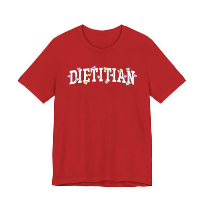 Red tshirt with arched text "DIETITIAN" with multi-colored Valentine heart candy sprinkled throughout the letters
