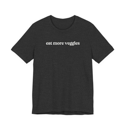 Black t-shirt with 'eat more veggies' text on a white background