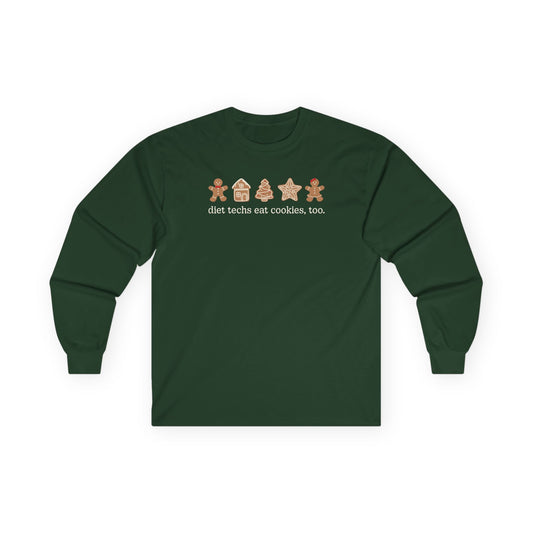Green long-sleeve shirt with gingerbread-themed design on a white background