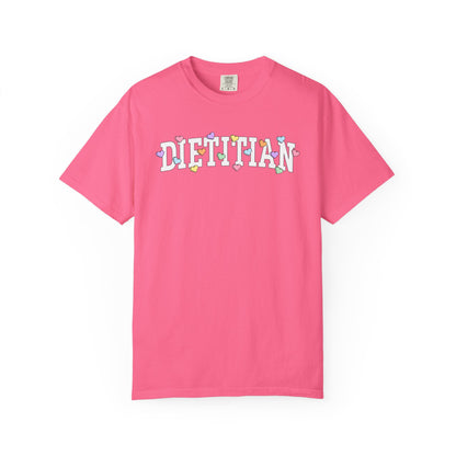 Hot pink tshirt with arched text "DIETITIAN" with multi-colored Valentine heart candy sprinkled throughout the letters