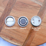 Pinback button, magnet, or badge reel topper options