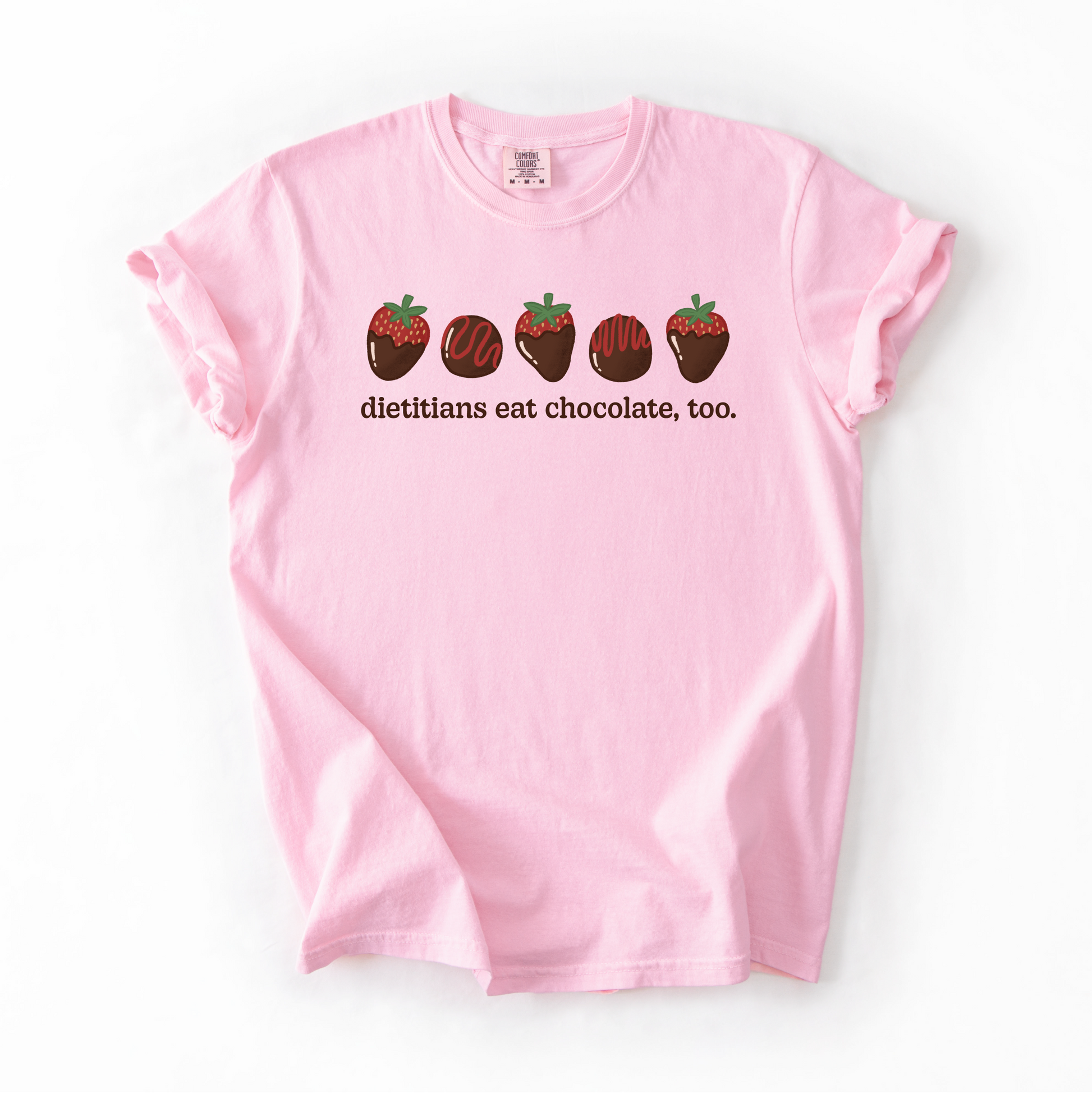Pink tshirt with chocolate covered strawberries and truffles with the text "dietitians eat chocolate, too."