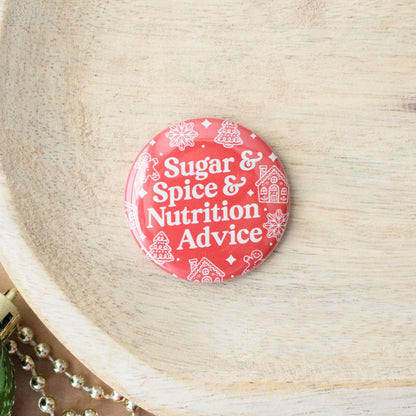 Red button with 'Sugar & Spice & Nutrition Advice' text on a wooden surface