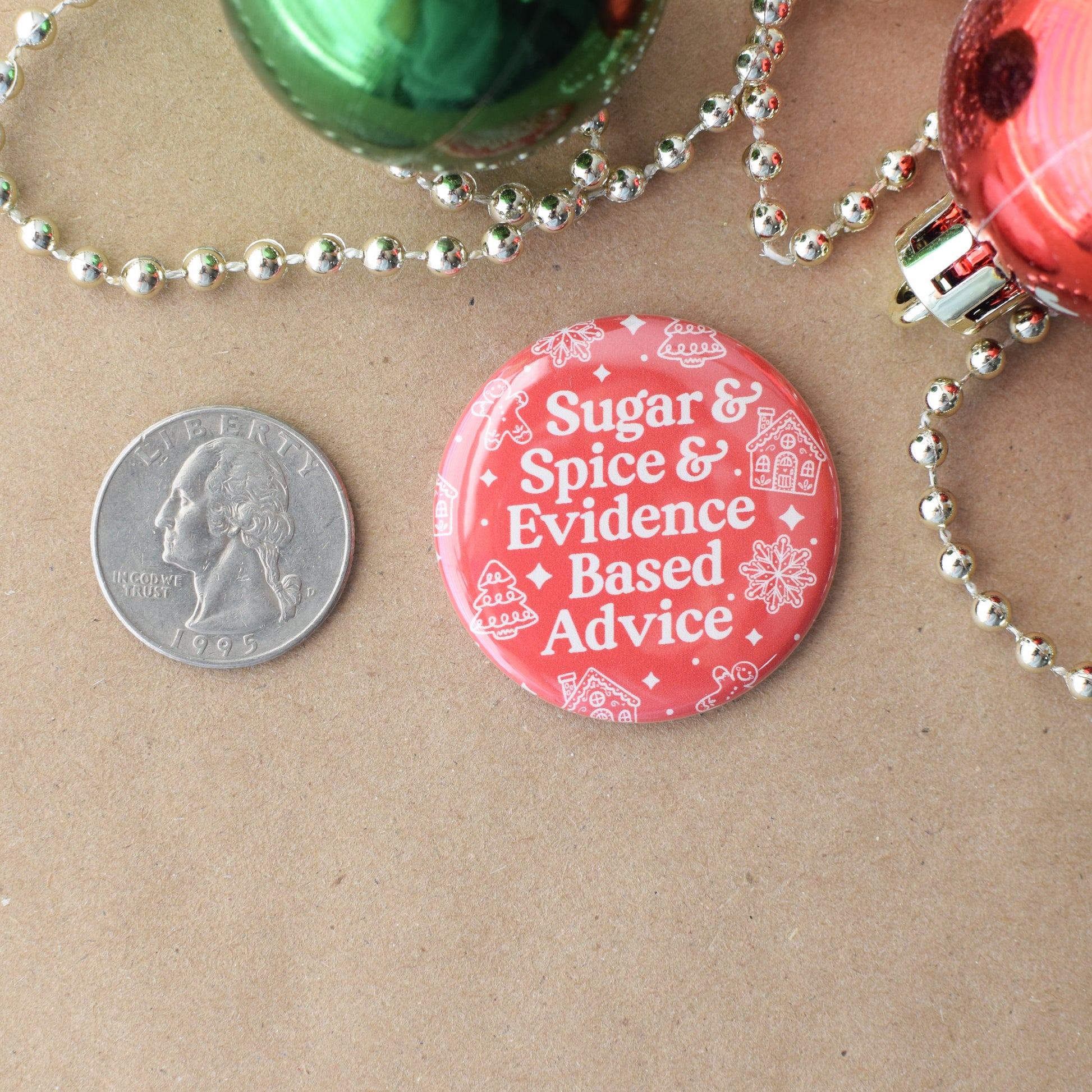 Red button with text 'Sugar & Spice & Evidence Based Advice' next to a quarter on brown paper.