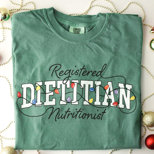 Green tshirt with Registered Dietitian Nutrition text tangled in Christmas lights
