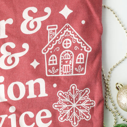 Close up of Red t-shirt with white gingerbread cookie graphics on a decorative background
