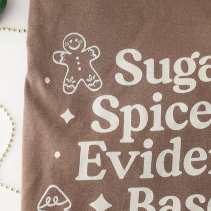Brown fabric with white text and gingerbread man design on a white background