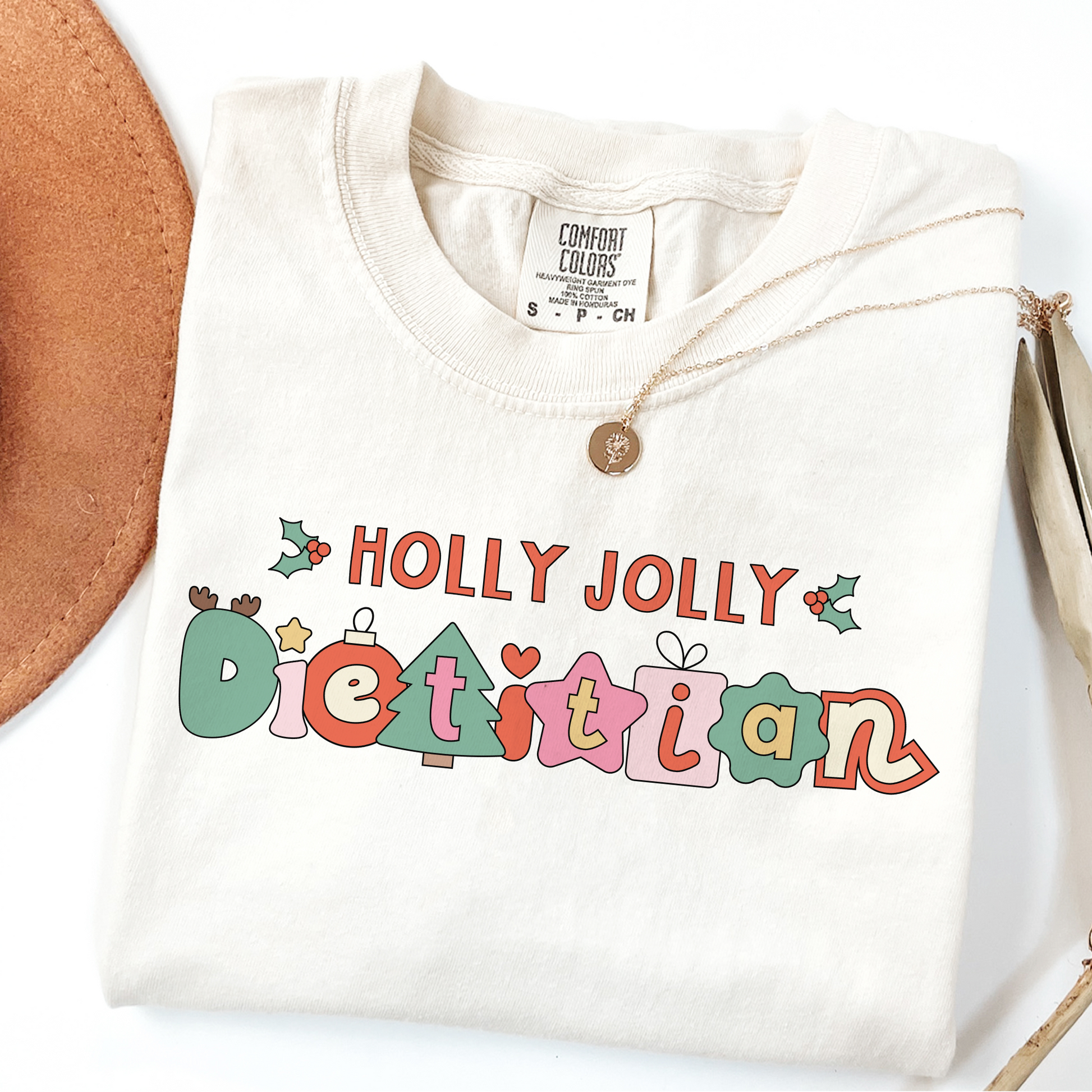 Ivory tshirt with 'Holly Jolly Dietitian' text on a white background