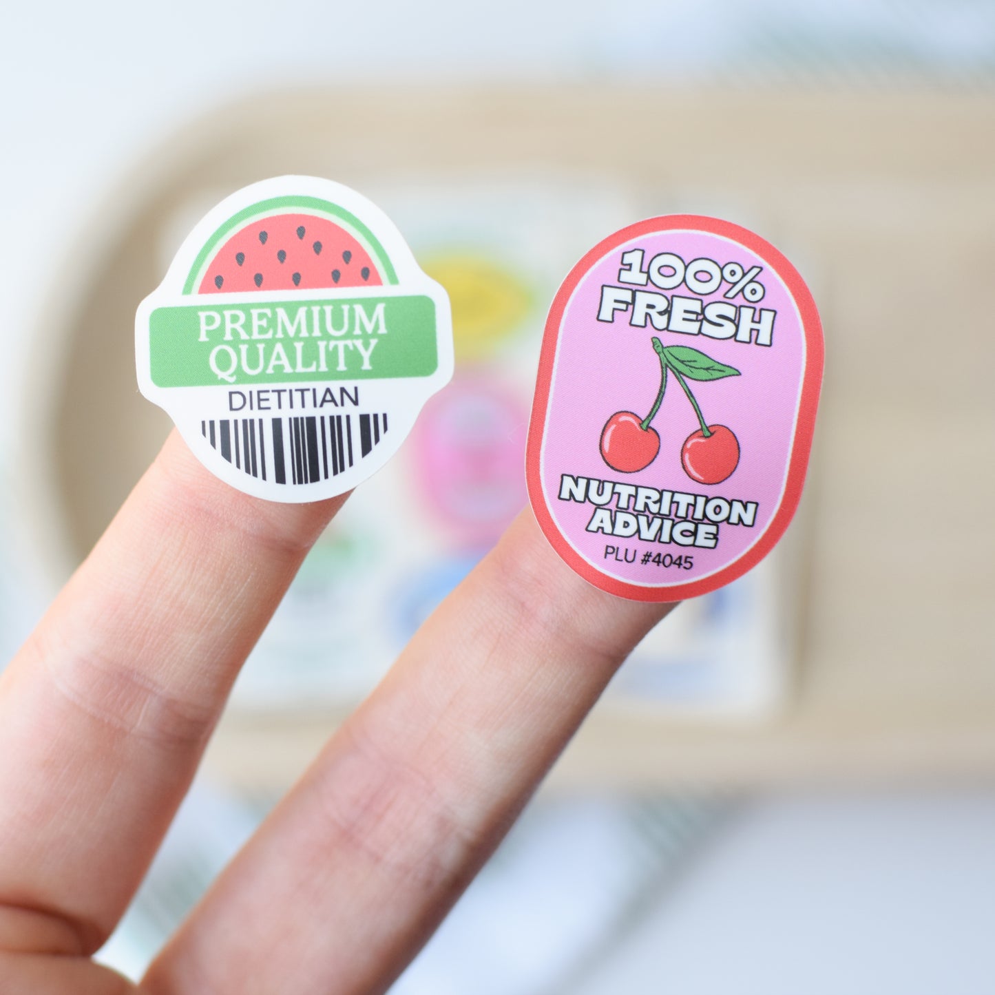 Two stickers on a finger with 'Premium Quality Dietitian' and '100% Fresh Nutrition Advice' text.
